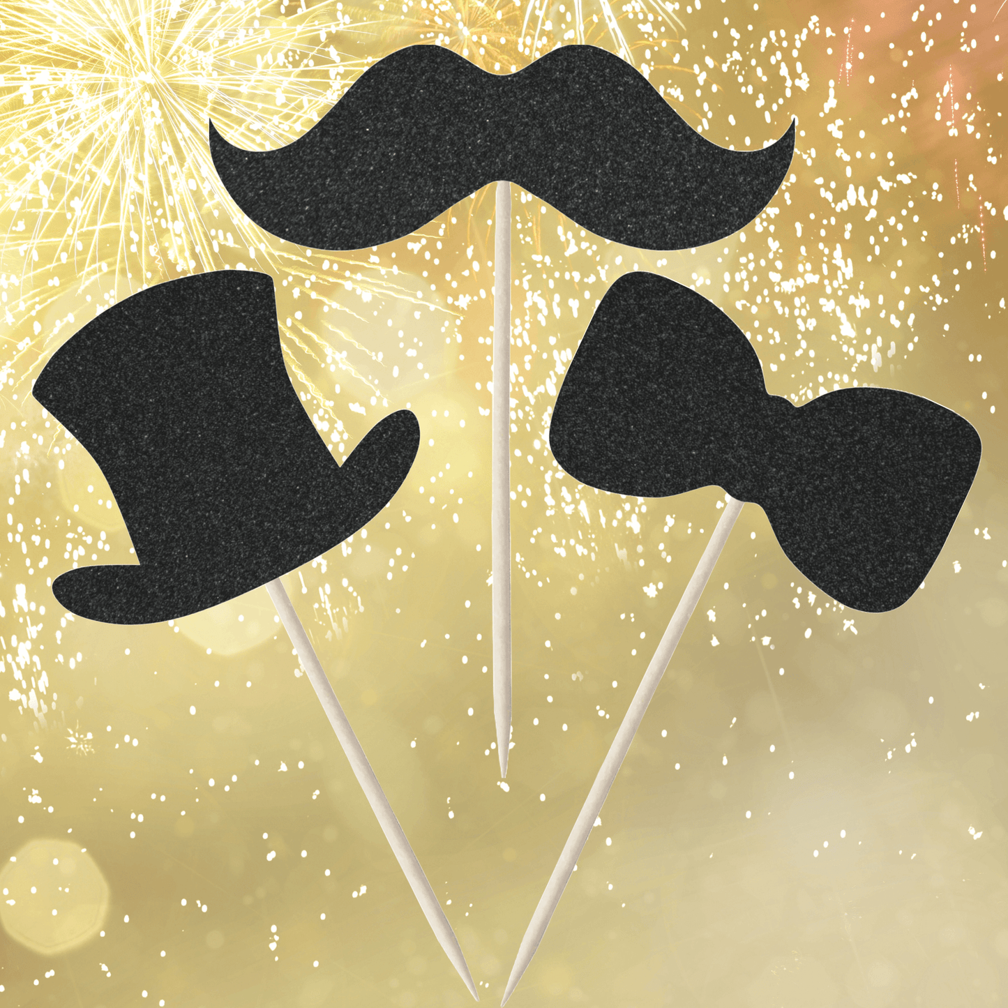 Glitter gentleman-themed cupcake toppers featuring black moustache, top hat, and bow tie against a festive background.