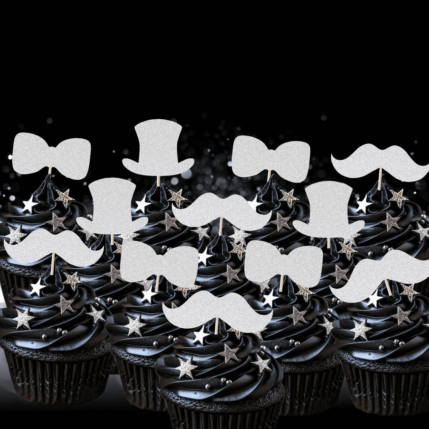 Gentleman themed glitter cupcake toppers on black frosted cupcakes, featuring top hats, bow ties, and moustaches.