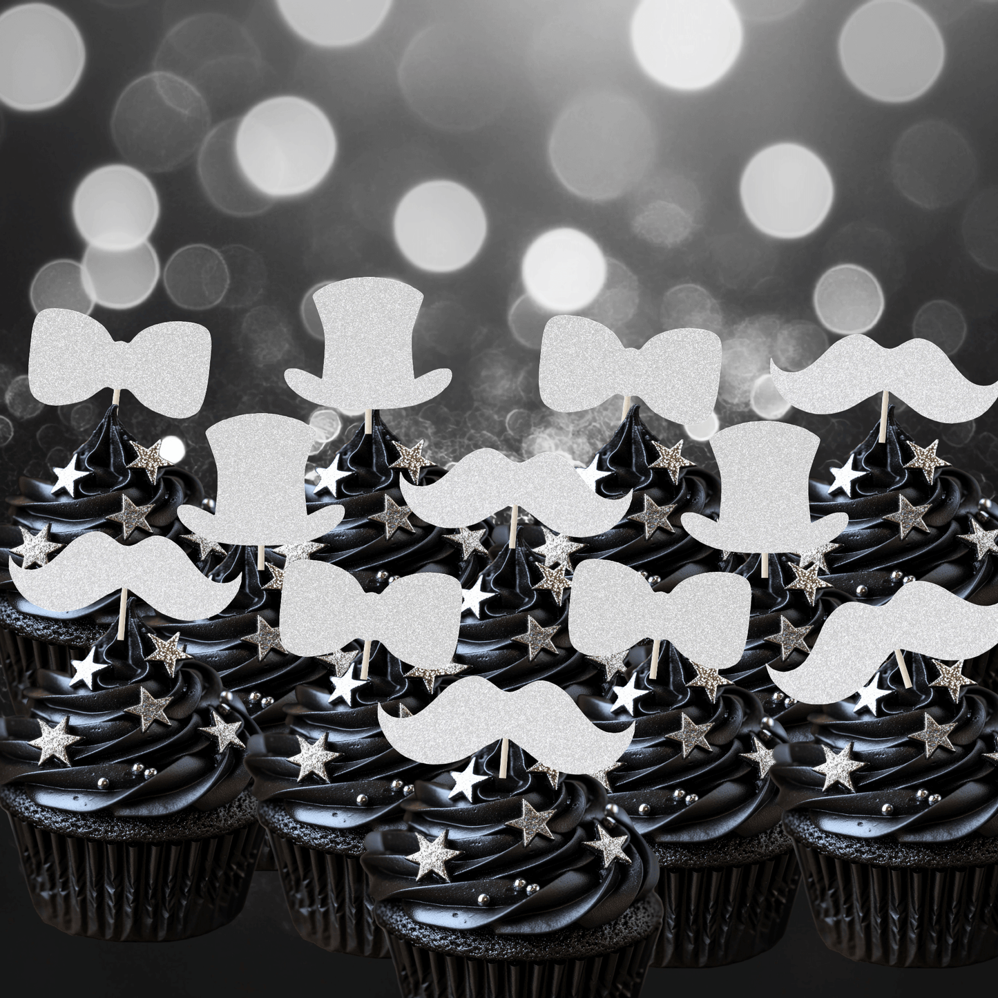 Glitter gentleman themed cupcake toppers on black frosted cupcakes, featuring top hats, moustaches, and bow ties.