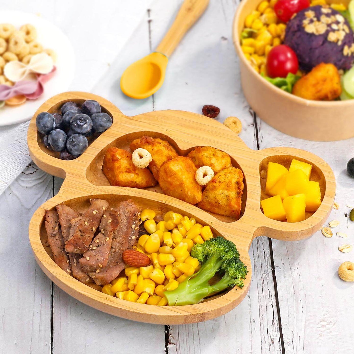 Vinsani bamboo monkey plate with 4 sections, filled with healthy foods for kids, showcasing natural bamboo and fun design.