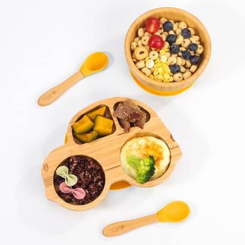 Vinsani natural bamboo kids plate, bowl, and spoons set with diverse food sections, offering a fun, durable, and non-slip dining experience.