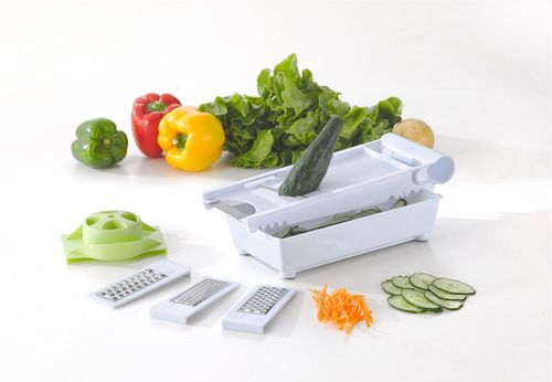 Vinsani 6 In 1 Grater Green & White with interchangeable blades and fresh vegetables on a kitchen counter.