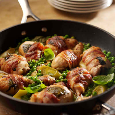 Bacon Wrapped Chicken with Leeks Peas and Basil