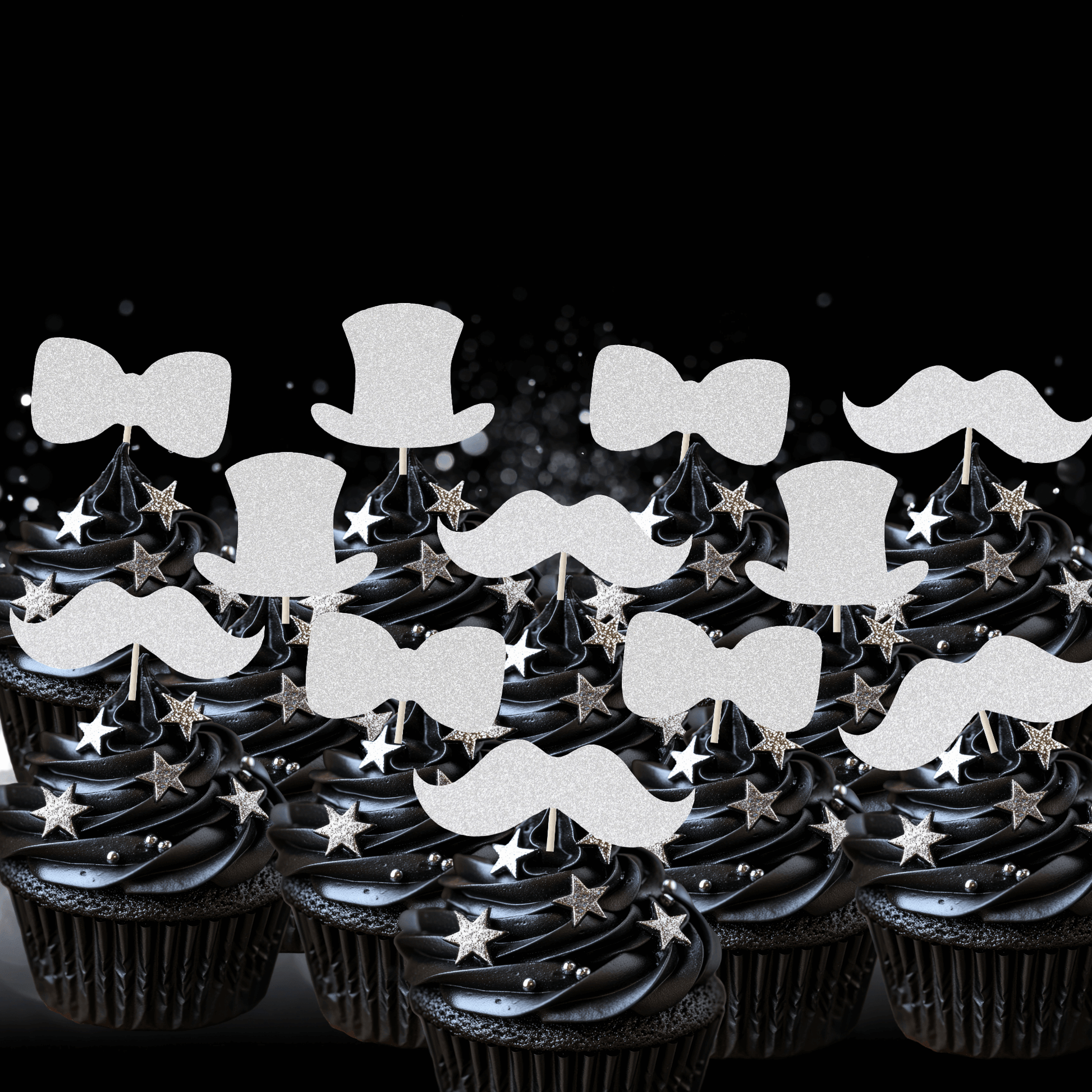 Gentleman themed glitter cupcake toppers on black frosted cupcakes, featuring top hats, bow ties, and moustaches.