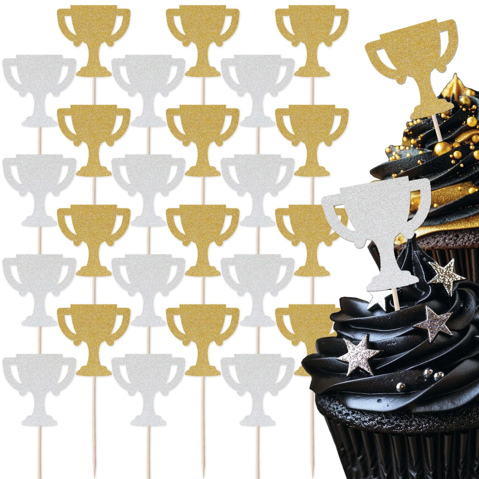 Gold and silver glitter trophy cupcake toppers set on a black cupcake for sport-themed celebrations.