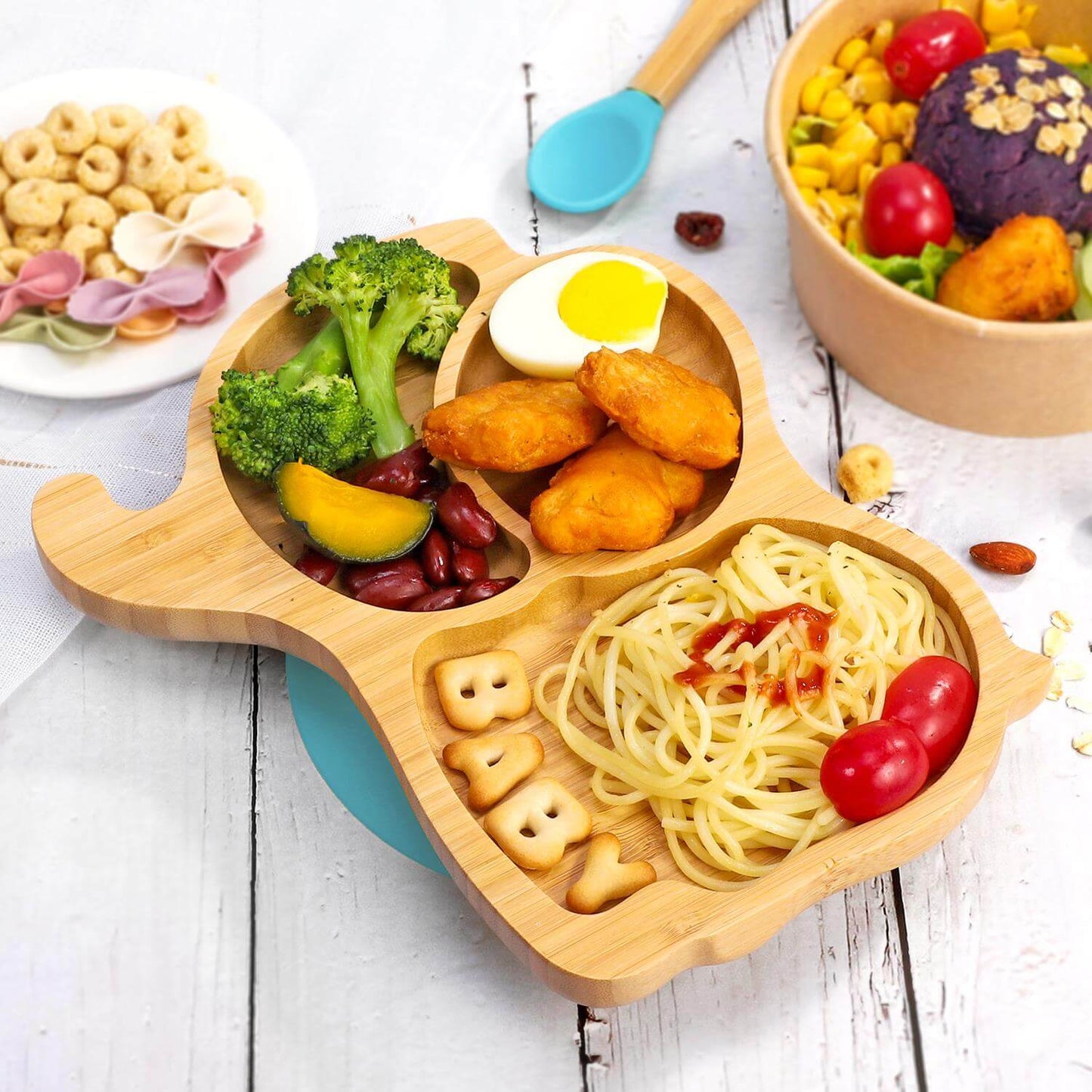 Vinsani bamboo elephant plate with sections for healthy meals, featuring pasta, broccoli, and chicken nuggets for kids.