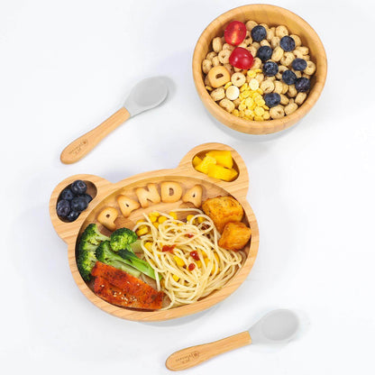 Vinsani bamboo panda plate with food, bowl of cereal, and two spoons for children's mealtime fun.