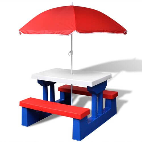 Kids' multicolour picnic table with red parasol and blue benches for outdoor seating.