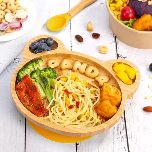 Vinsani bamboo panda plate with pasta, chicken, broccoli, fruit, and fun bamboo letters for kids' meals.